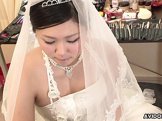 Brunette Emi Koizumi fucked in excess of wedding dress uncensored.
